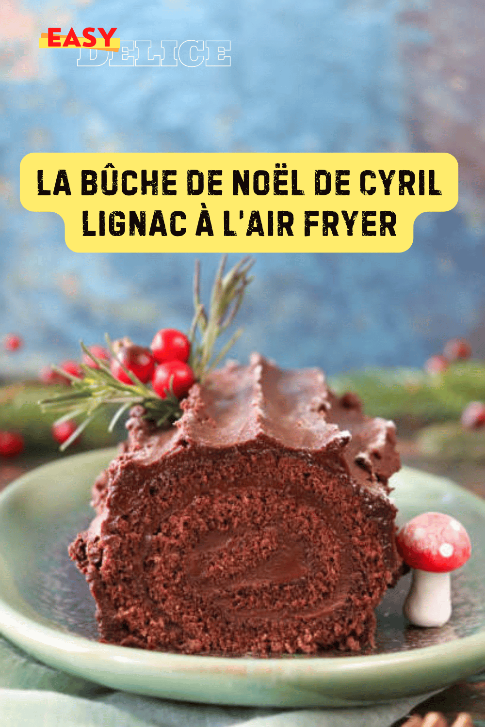 Bûche de Noël chocolatée de Cyril Lignac, garnie d’une ganache brillante et décorée pour les fêtes.

