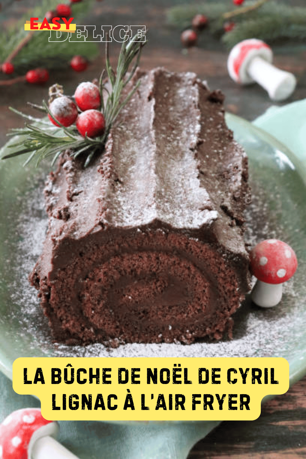 Bûche de Noël chocolatée de Cyril Lignac, garnie d’une ganache brillante et décorée pour les fêtes.

