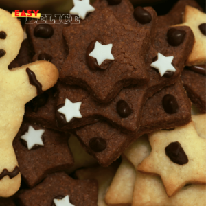 Sablés de Noël au chocolat, décorés avec du glaçage blanc et des motifs festifs.