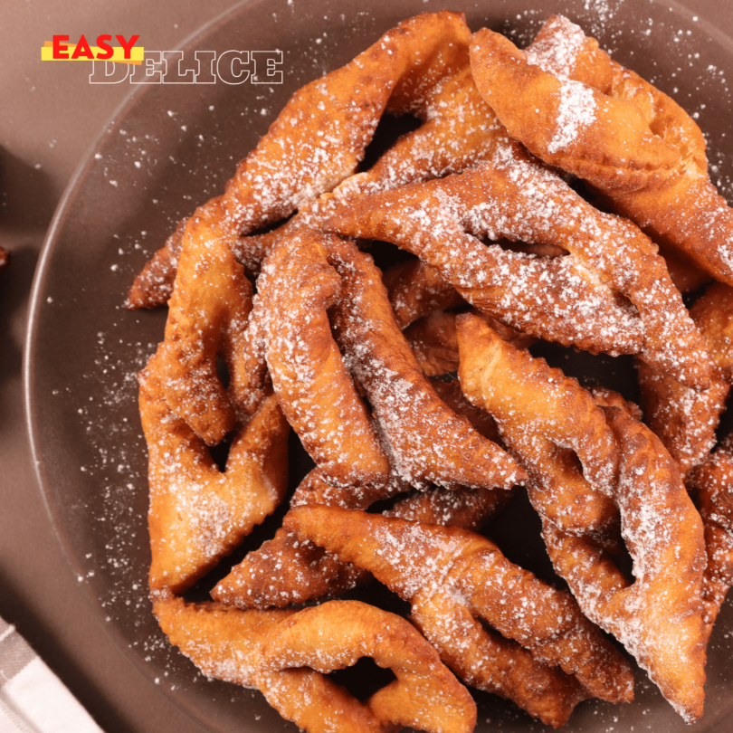 Bugnes dorées et légères préparées au Air Fryer, saupoudrées de sucre glace.