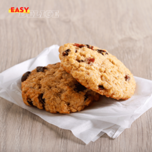 Cookies aux cranberries dorés et moelleux, servis sur une assiette pour un goûter sain.