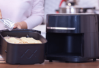 Airfryer moderne sur un comptoir de cuisine, rempli de frites dorées et croquantes.